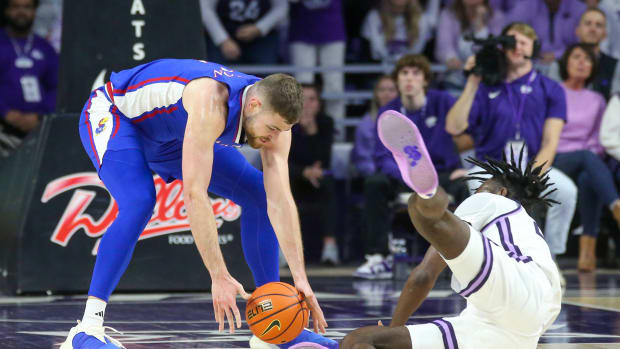 Feb 5, 2024; Manhattan, Kansas, USA; Kansas Jayhawks center Hunter Dickinson (1) and Kansas State Wildcats forward Arthur Kaluma (24) go after a loose ball during the first half at Bramlage Coliseum. Mandatory Credit: Scott Sewell-USA TODAY Sports